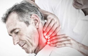 A chiropractor gently adjusting a patient's neck in a calm, clinical setting.